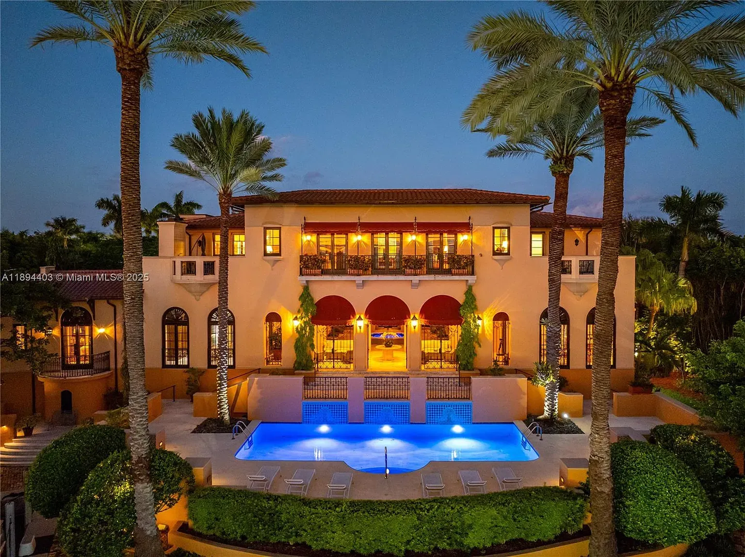 Front facade doing sunset stucco and terracotta. Kinda postcard-y, not mad.