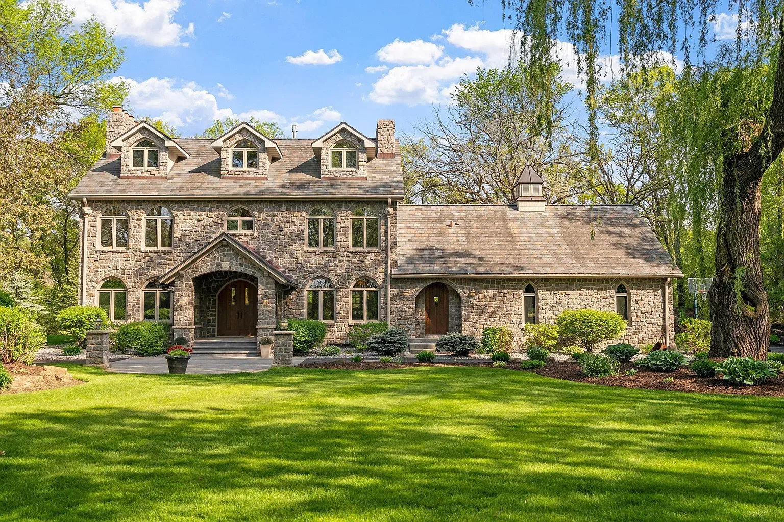 Big stone front with a heap of gables. Looks expensive to heat.