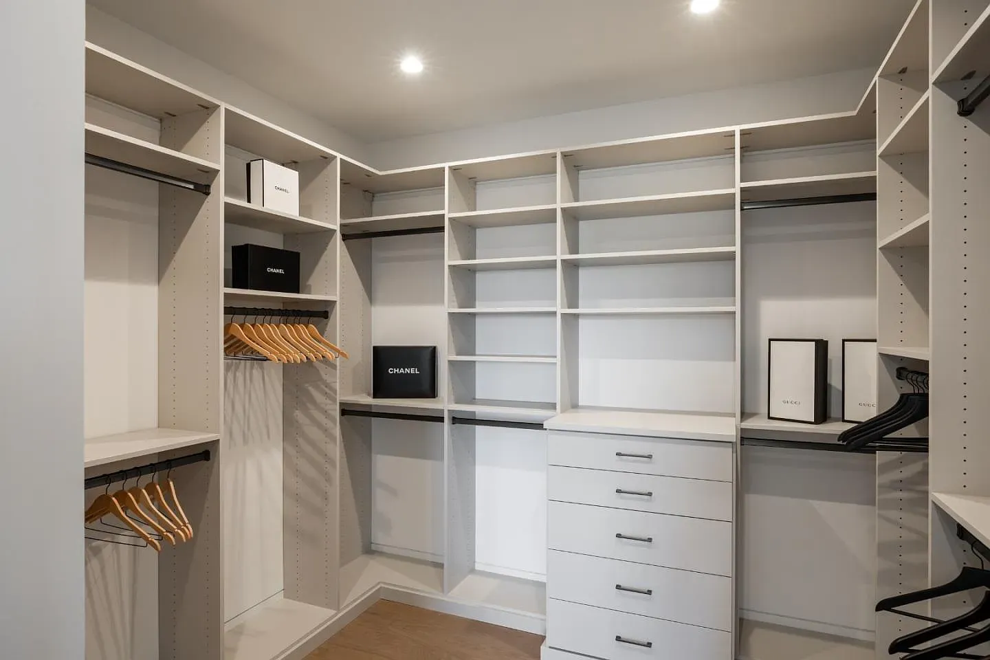 Walk-in closet just keeps going. Shelves, drawers, more shelves.