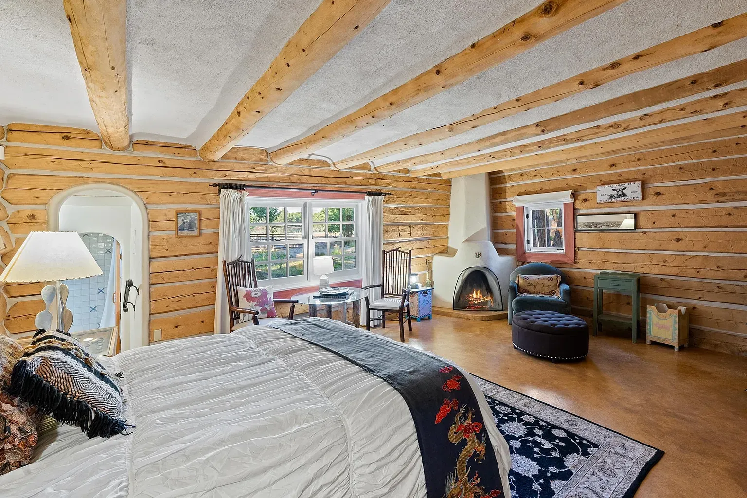 Log walls and beams, but not cabin-dark. Nice balance.