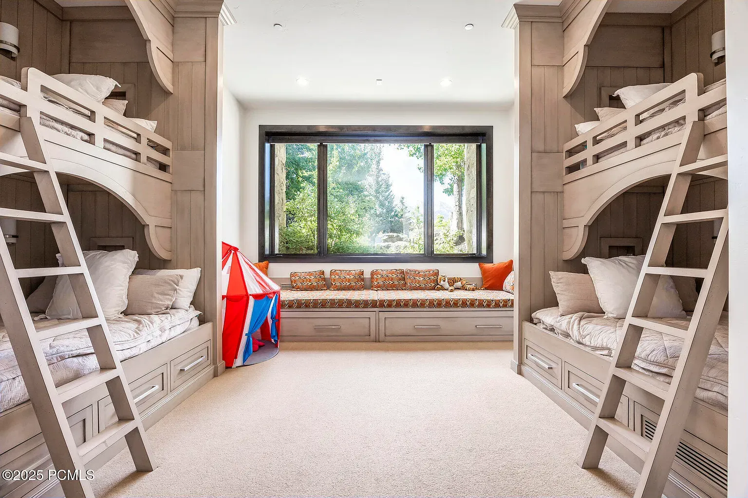 Bunk bed squad assembled. Light wood, cozy bedding, pretty serene for kids.