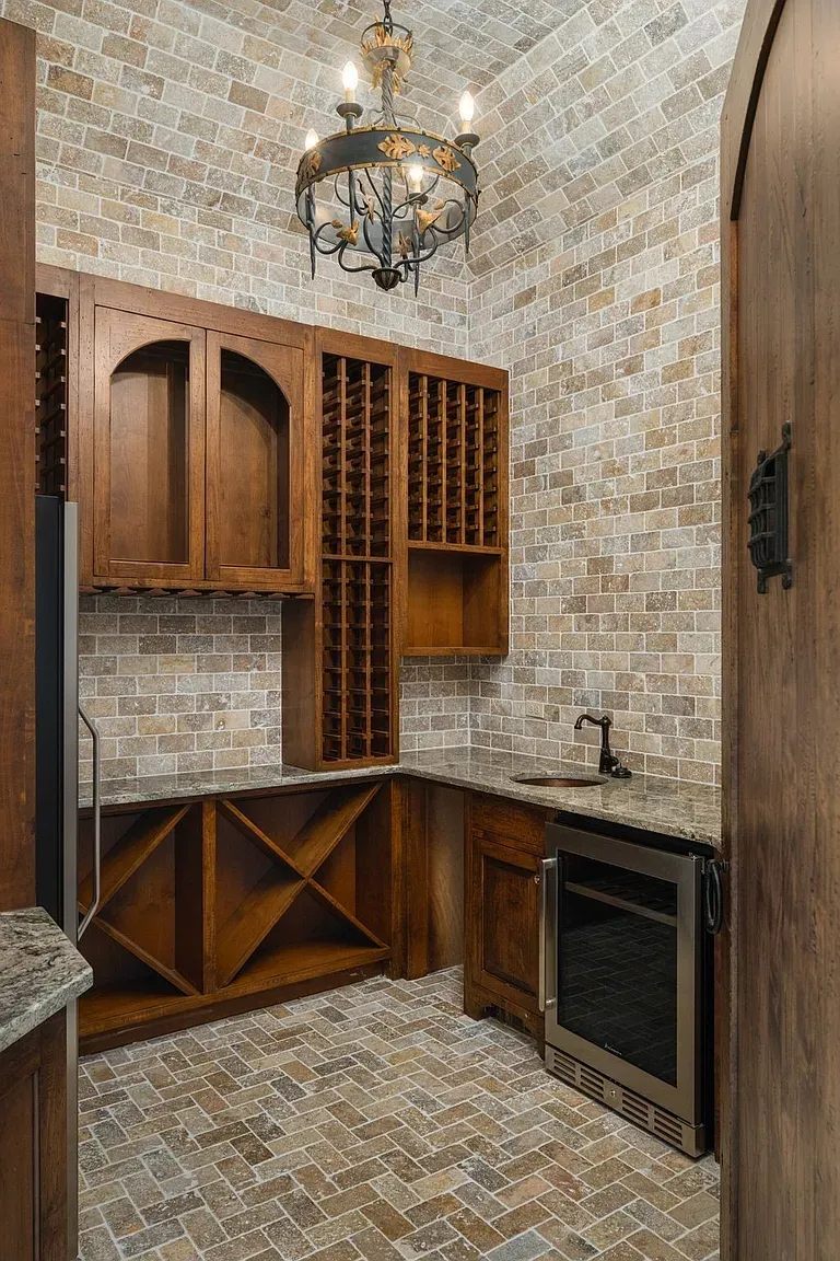 Wine cellar time. wood racks, stone walls, cozy lighting. Definitely a sit-and-sip.