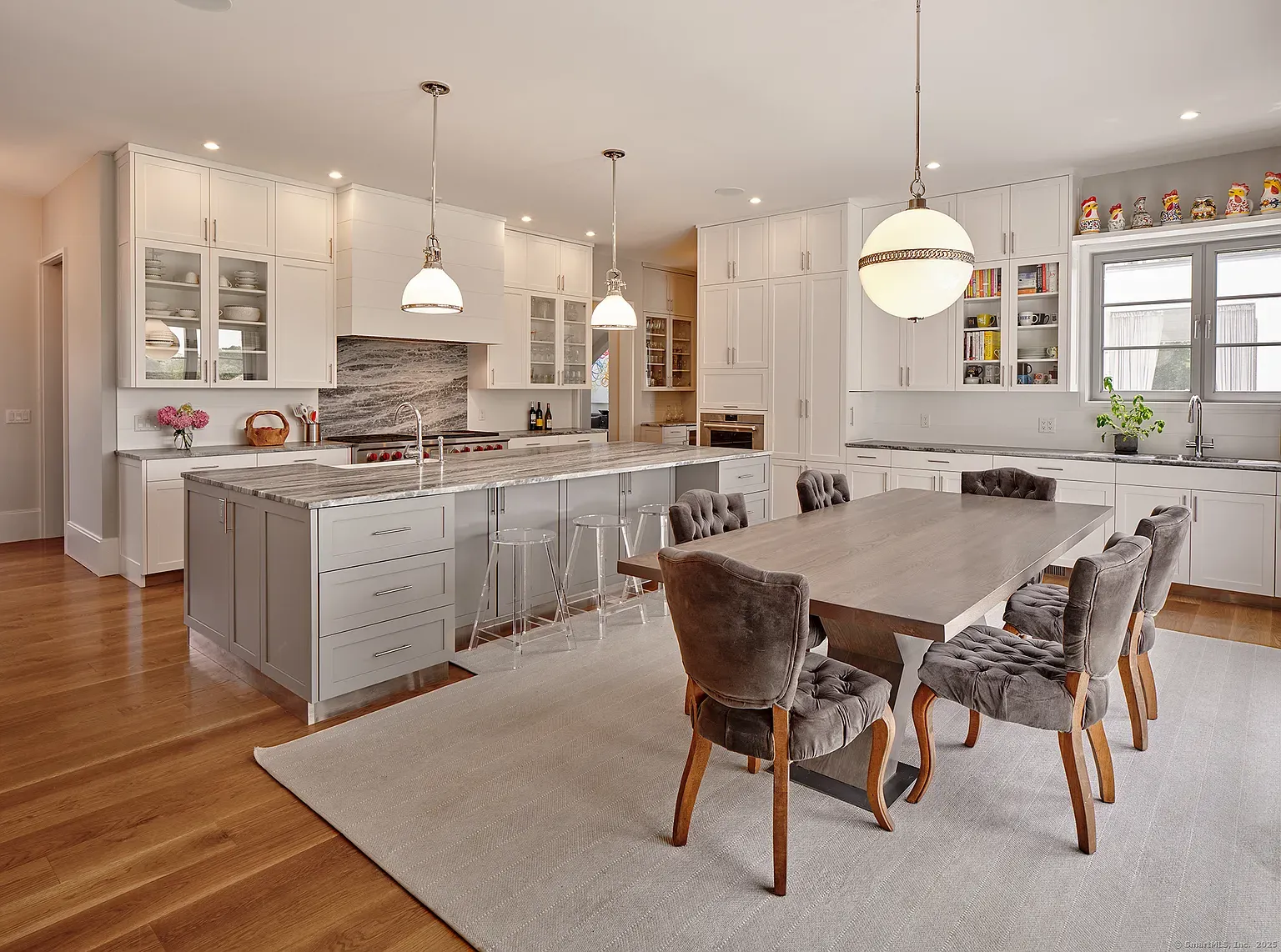 Not sure about this combo—gray cabinets with heavy veined marble. Too formal?