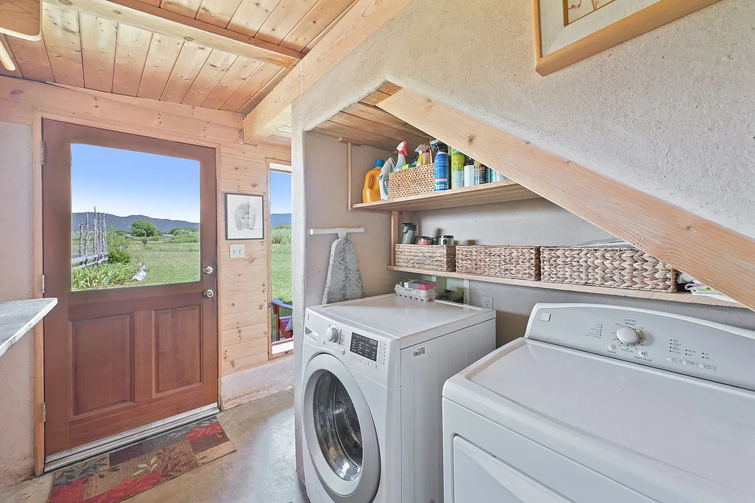 Laundry room goals. warm wood ceiling, soft walls, actually feels relaxing to fold.