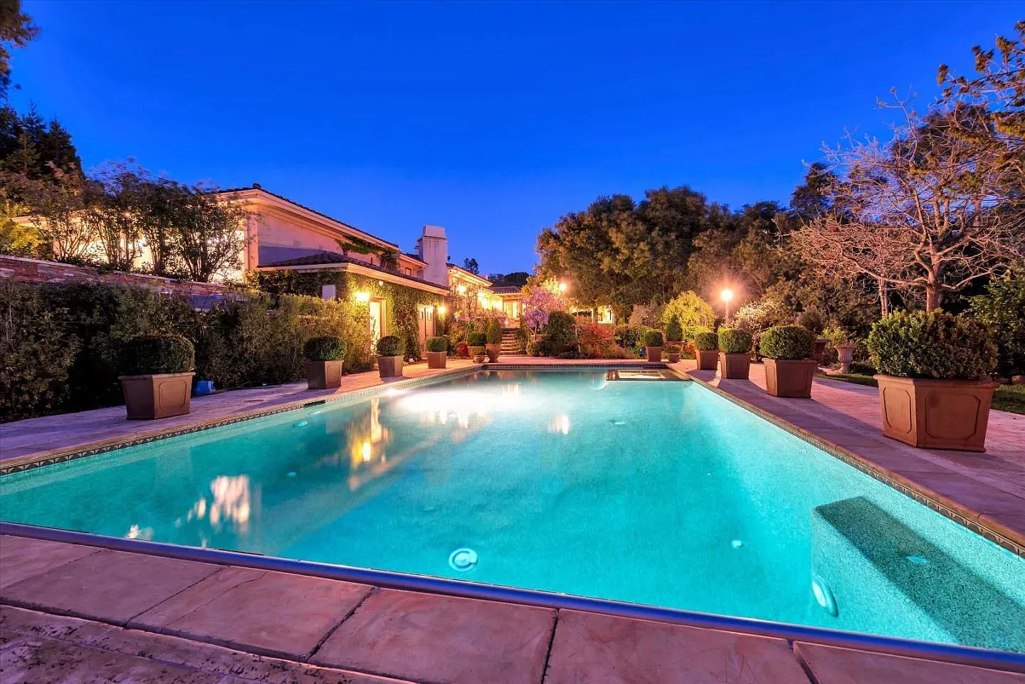 Pool at dusk looks a postcard. The stone deck is perfect.