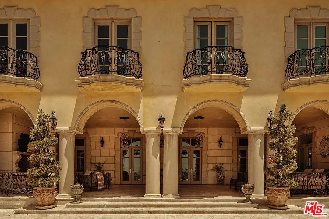 Entrance arches stacked up a wedding cake. Anyone know that stucco color?