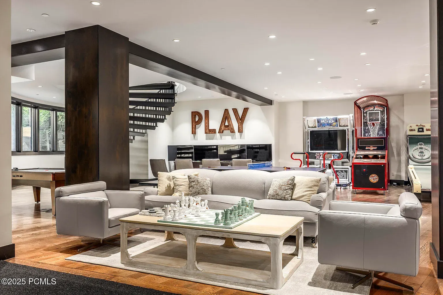 Game room bright and simple. Centerpiece table—ping-pong? Anyone know which model?