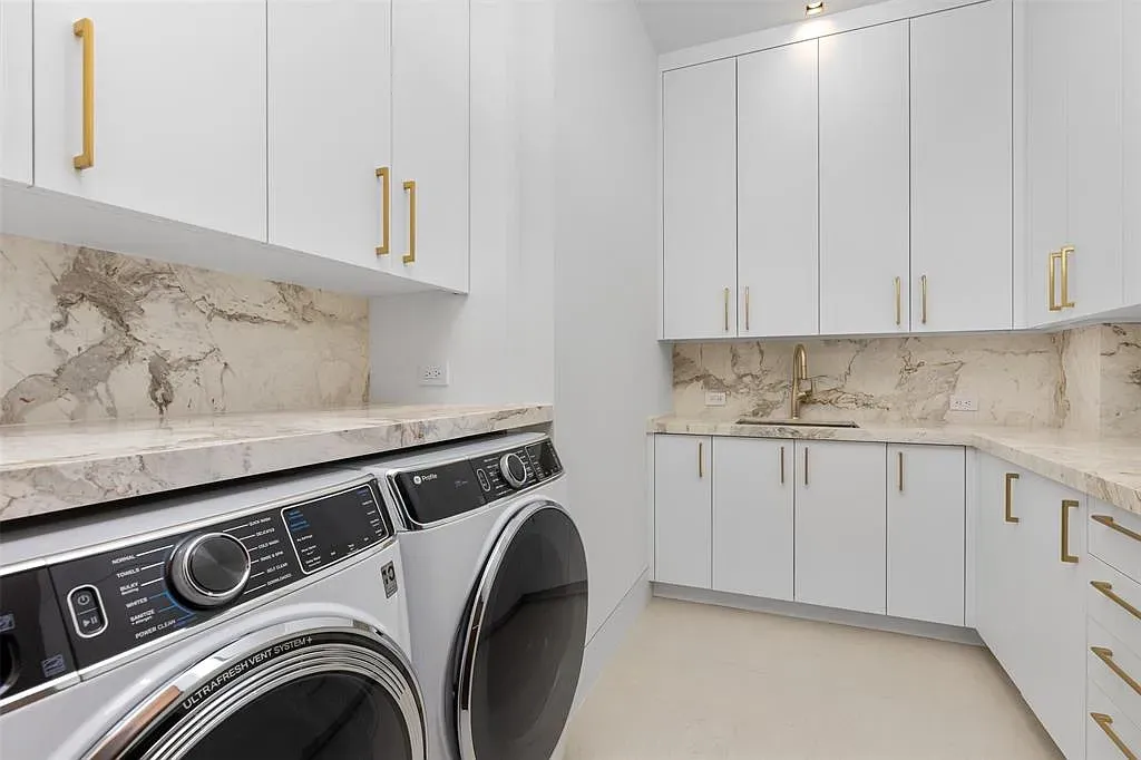 Laundry but make it fancy—white cabinets, gold pulls. Hidden hampers maybe?