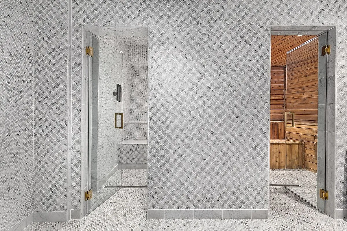 Marble spa room—shimmery whites and grays. Whisper-quiet, hotel energy.