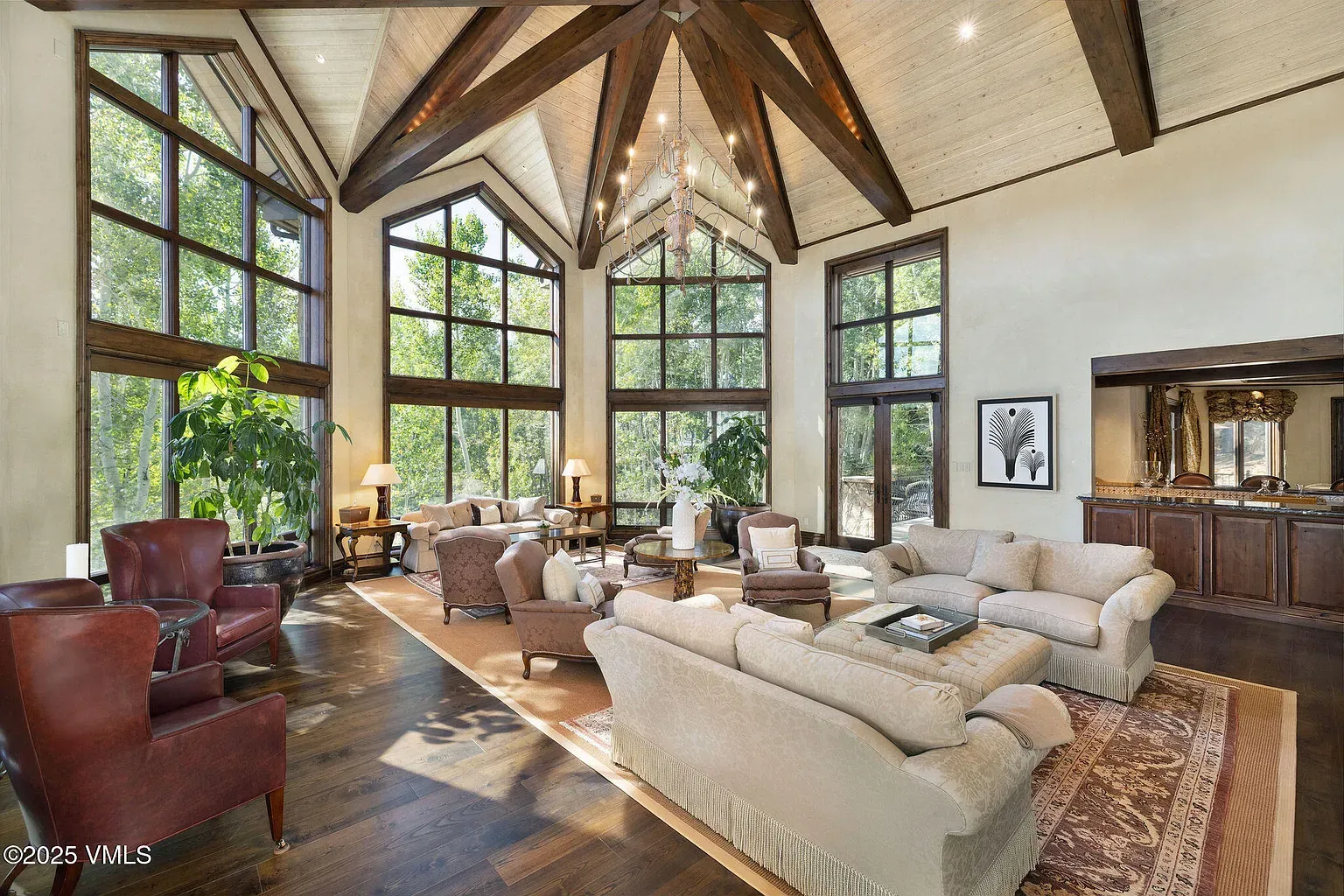 Big living room, cathedral beams. Cozy lodge feel without the kitsch.