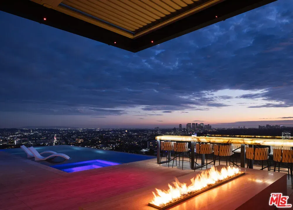 Okay, this rooftop pool at sunset? Ridiculous. Edges vanish into the sky.