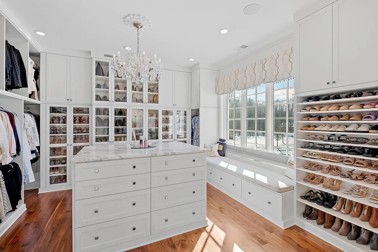 Separate dressing room in crisp white. Built-ins everywhere. Closet envy activated.