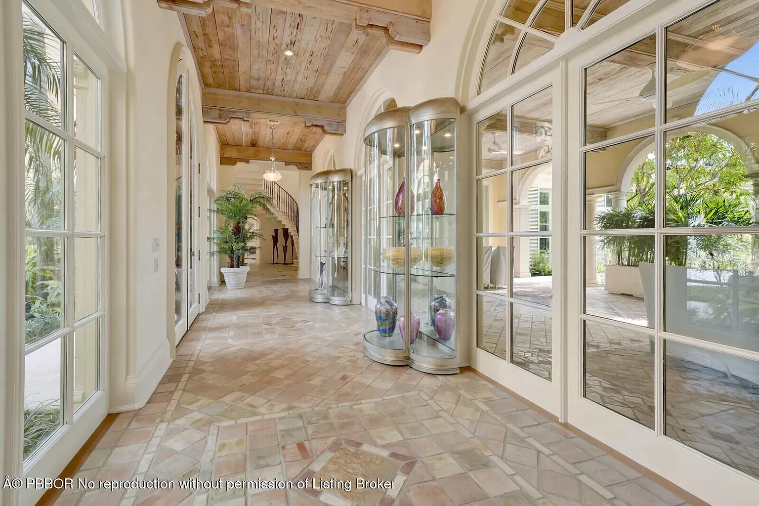 Entry goes terracotta herringbone. Warm and slightly old-world. Feet happy already.