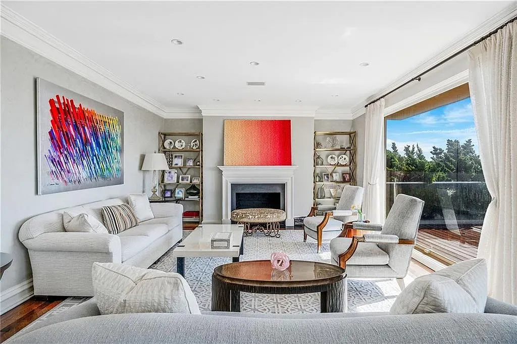 Another living shot—neutral walls, massive windows. Not sure it's cozy, though.