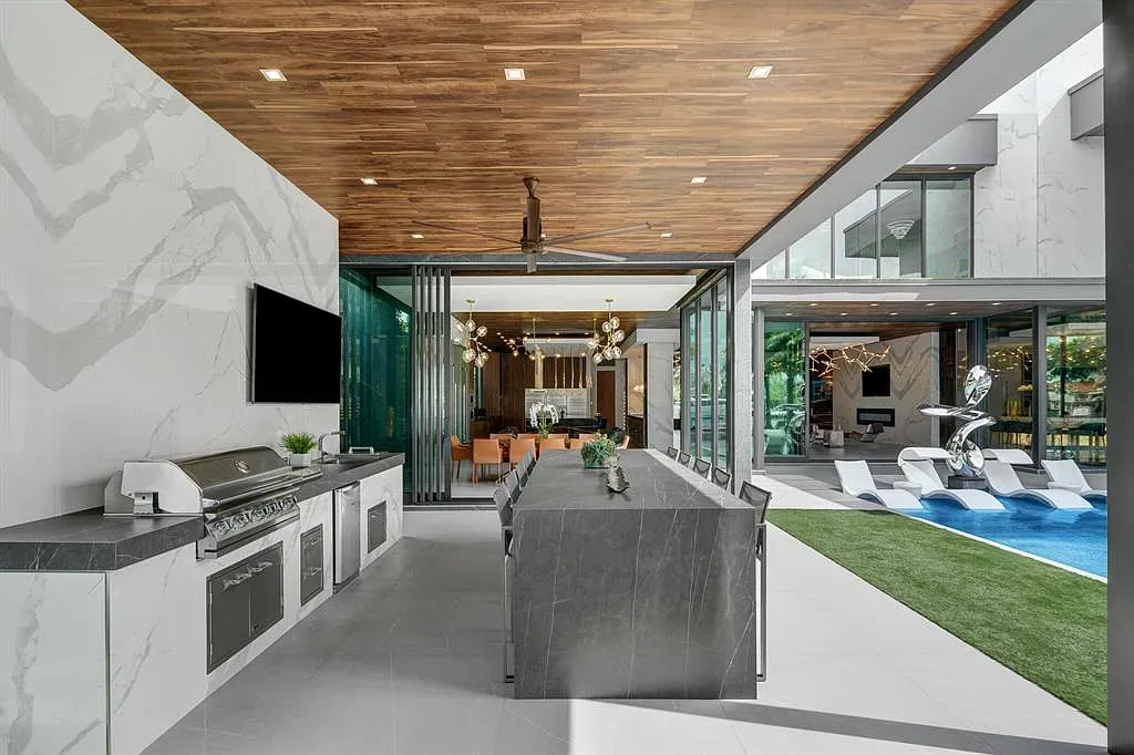 Slide those doors open and it’s party mode. Marble island looking slick.