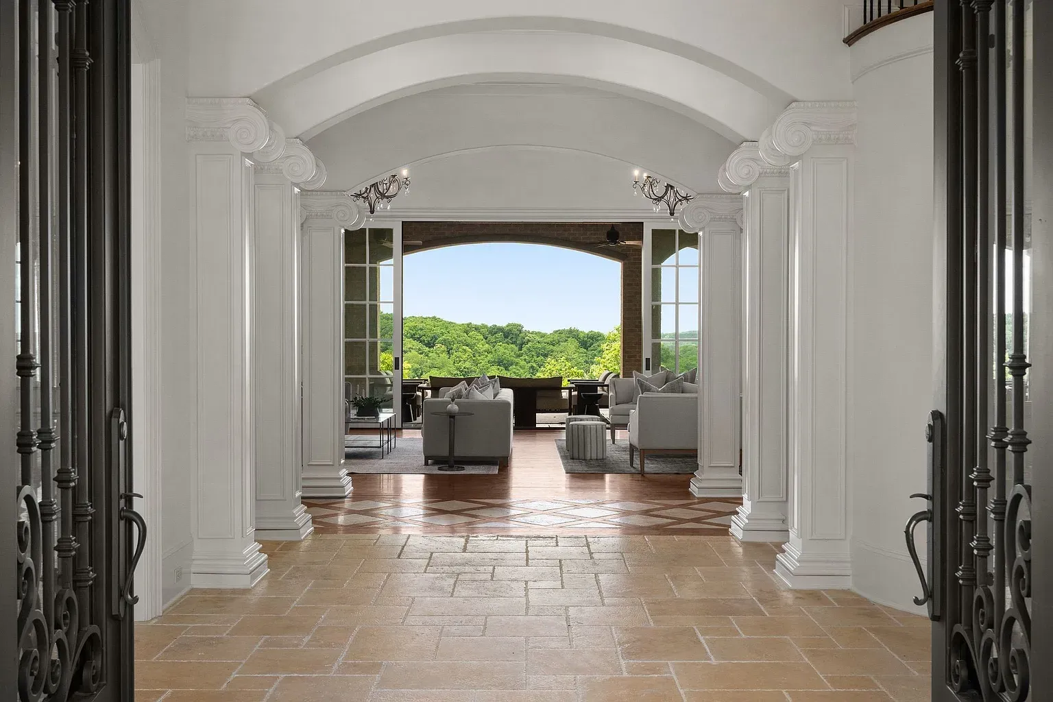 Grand entry with tall arches and pale tile. Yep, first impression lands.