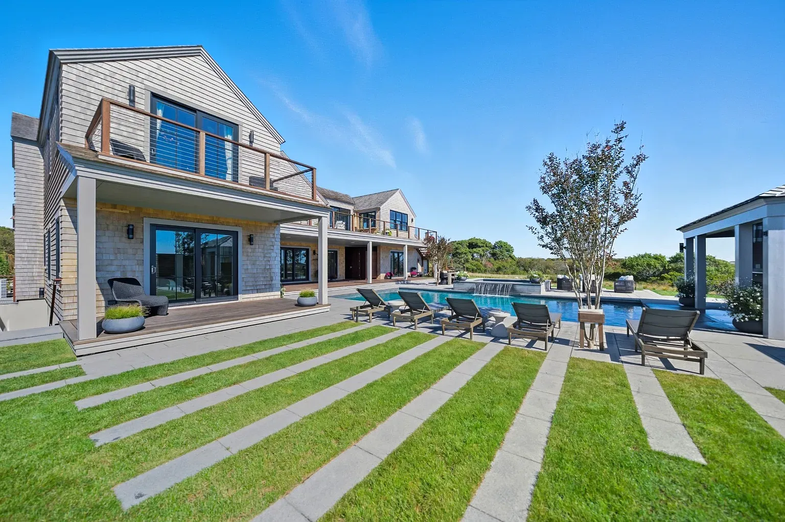 Pool is a big rectangle of calm. Deck says bring snacks.