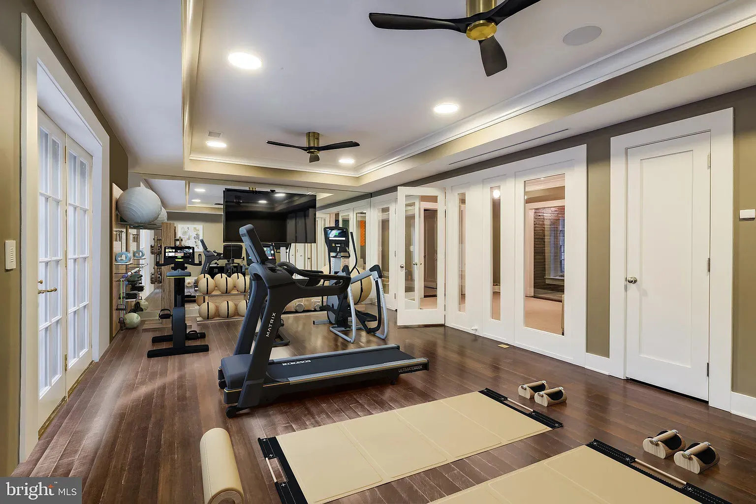 Here's the gym—beige walls, hardwood floors. Clean, not cold.