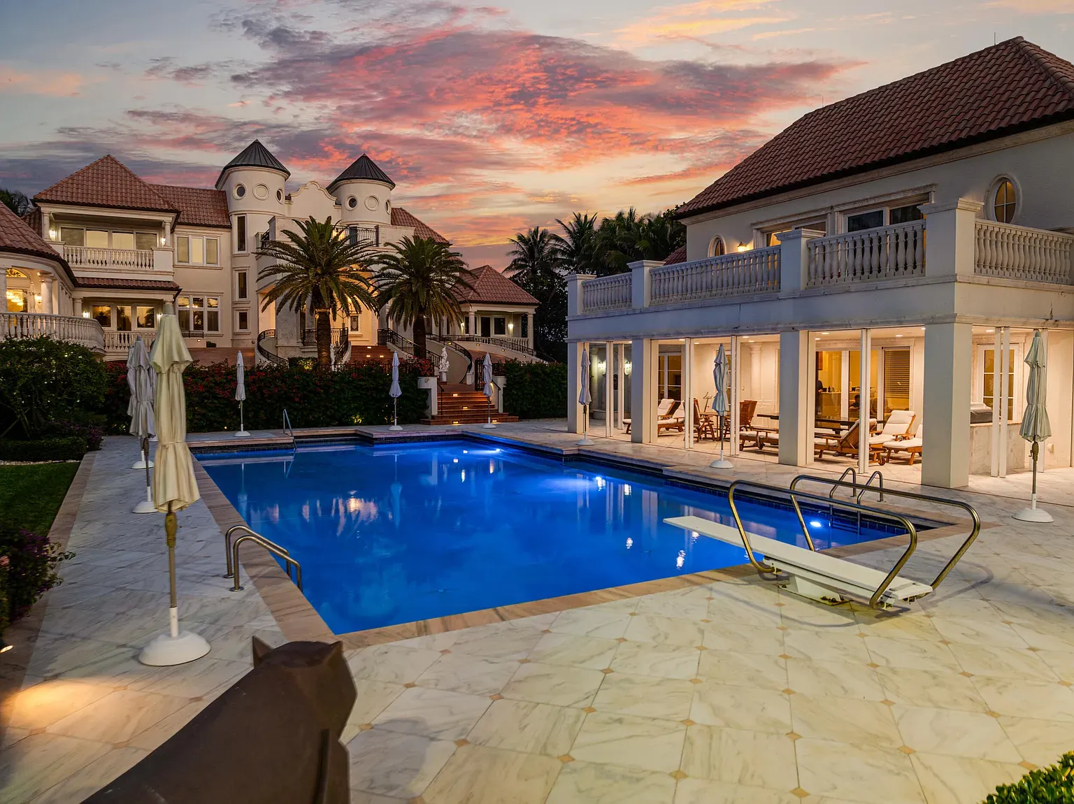 And then—poolside marble runway. Blue water mirroring sunset—yeah, I'm staying here.