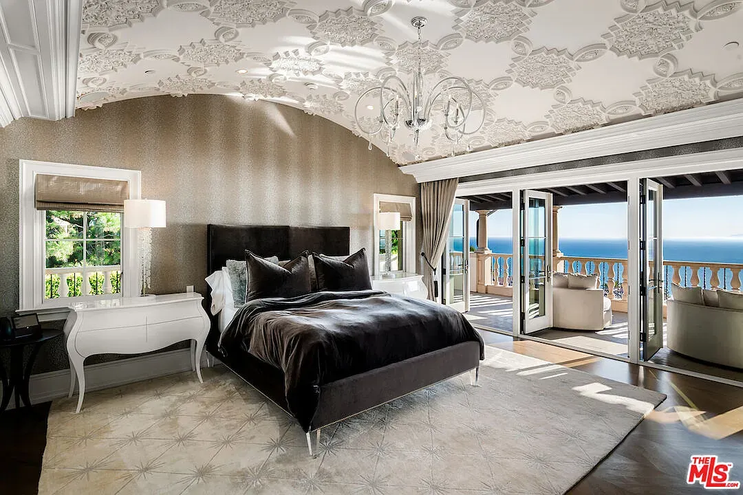 Not sure about the ceiling wallpaper, but the bed looks cloud-level comfy.