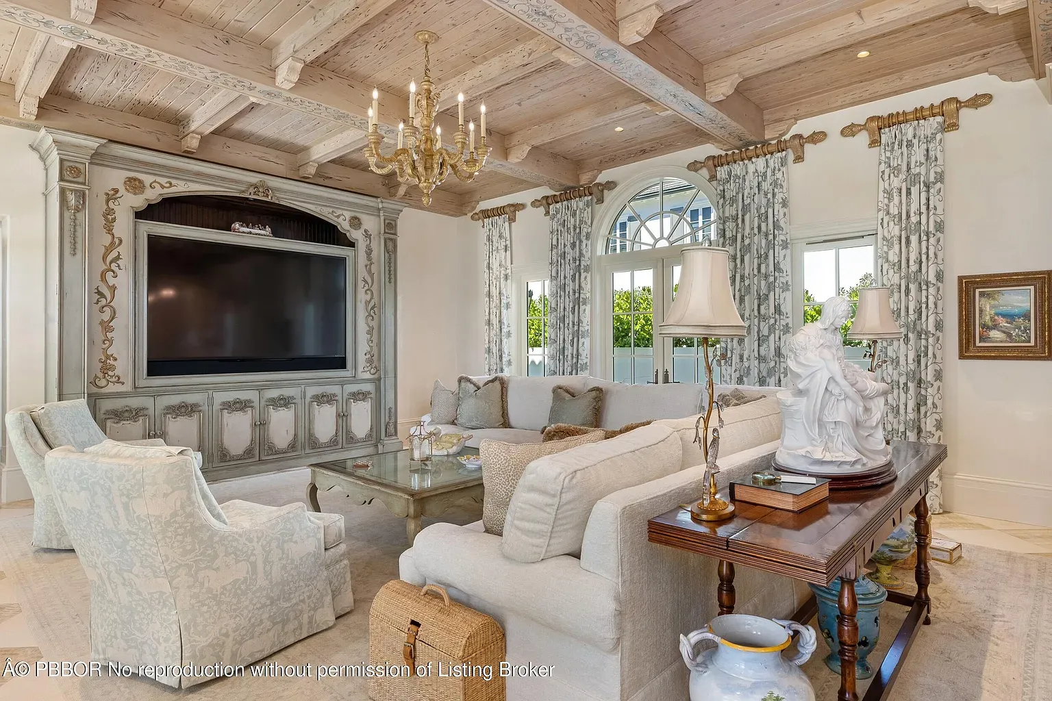 Light living room, oak coffered ceiling steals it. Cozy yet polished.