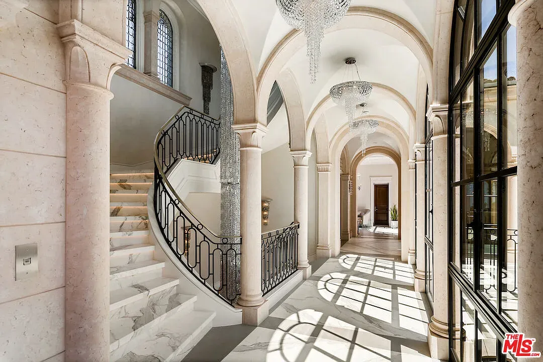 Sweeping staircase with iron curls. Very ‘make an entrance’ moment.