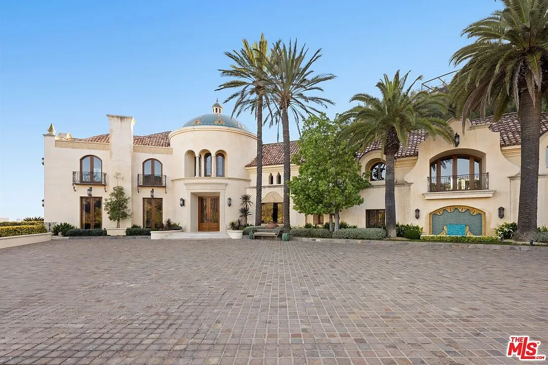 Here's the front—stucco, arches, and that bright blue dome stealing the show.