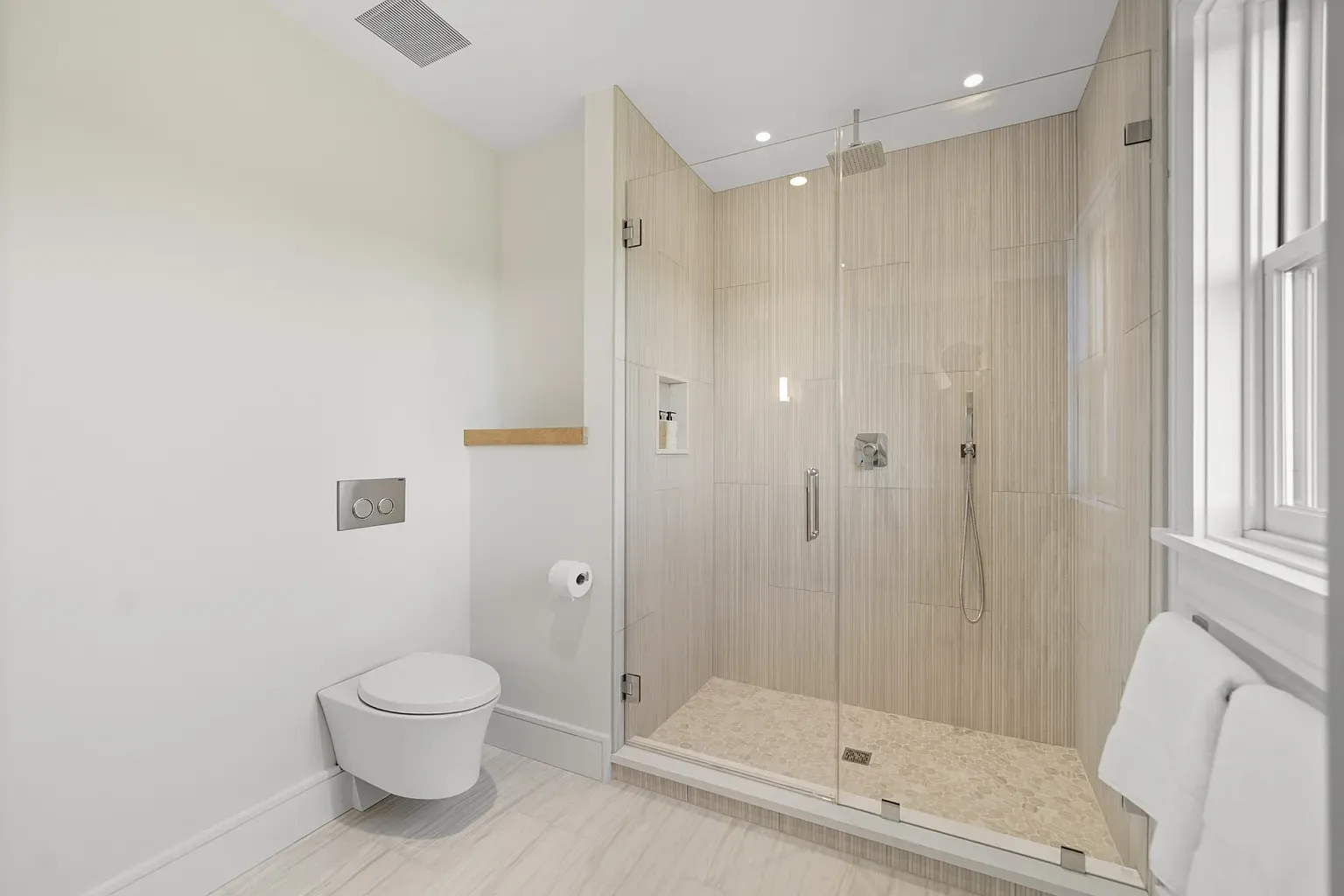 Walk-in shower goals. Clear glass, soft beige tile, spa vibes.
