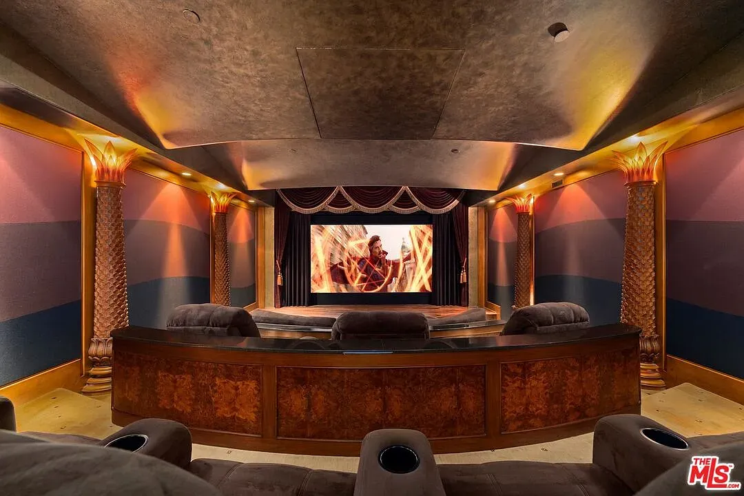 And then the theater goes full moody—velvet blues, layered walls. Popcorn underdressed.