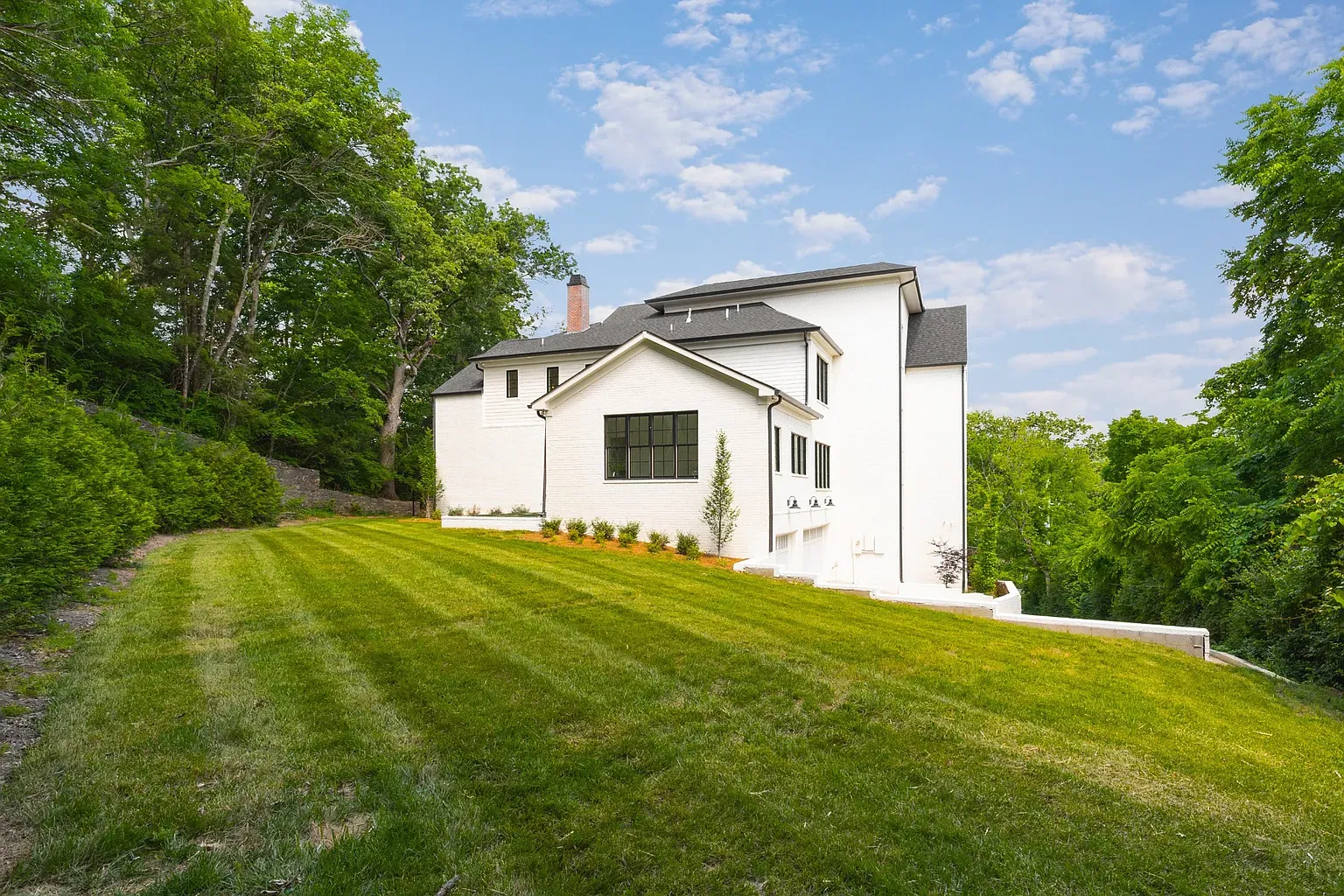 Clean white exterior with dark trim. Simple and sharp.