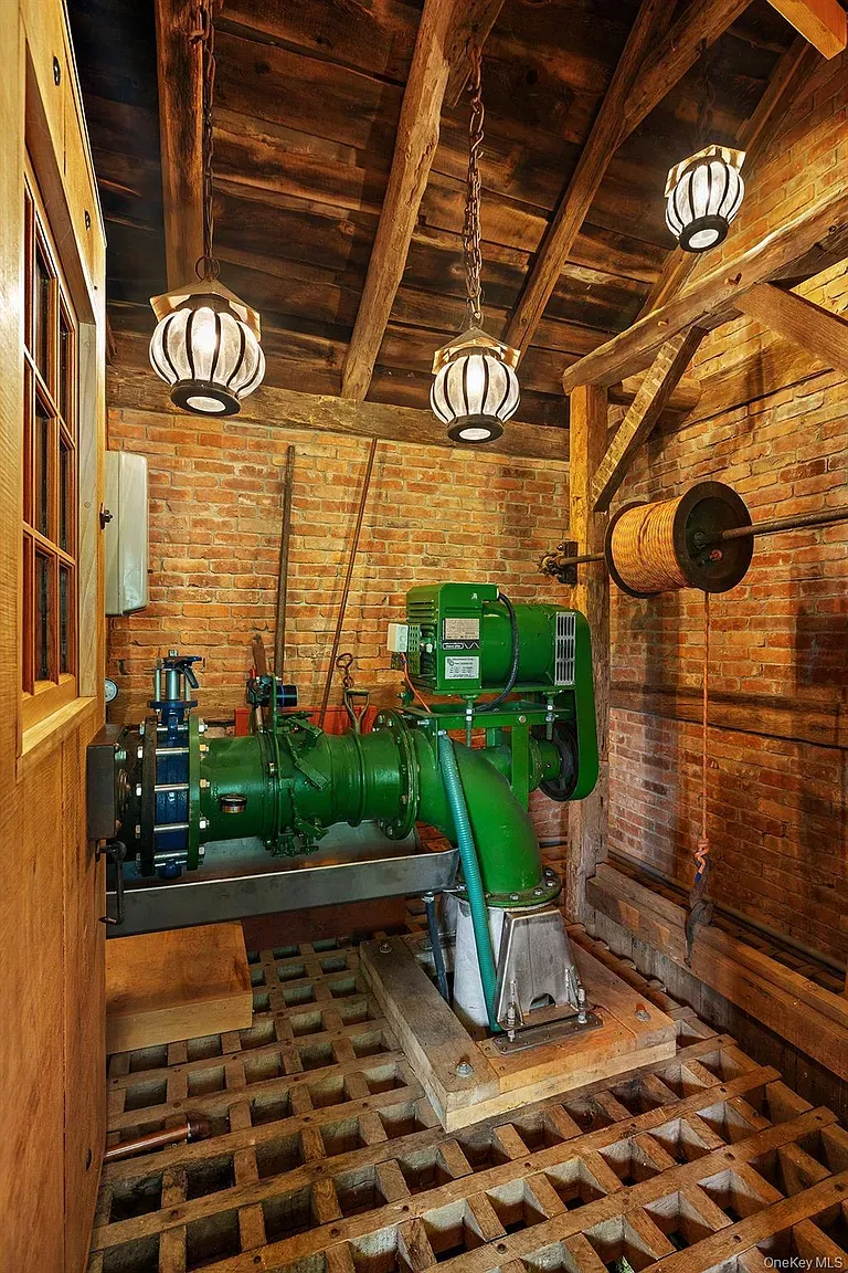 Brick-and-beam mashup. Kinda industrial cabin. Anyone know why the lights hang so low?