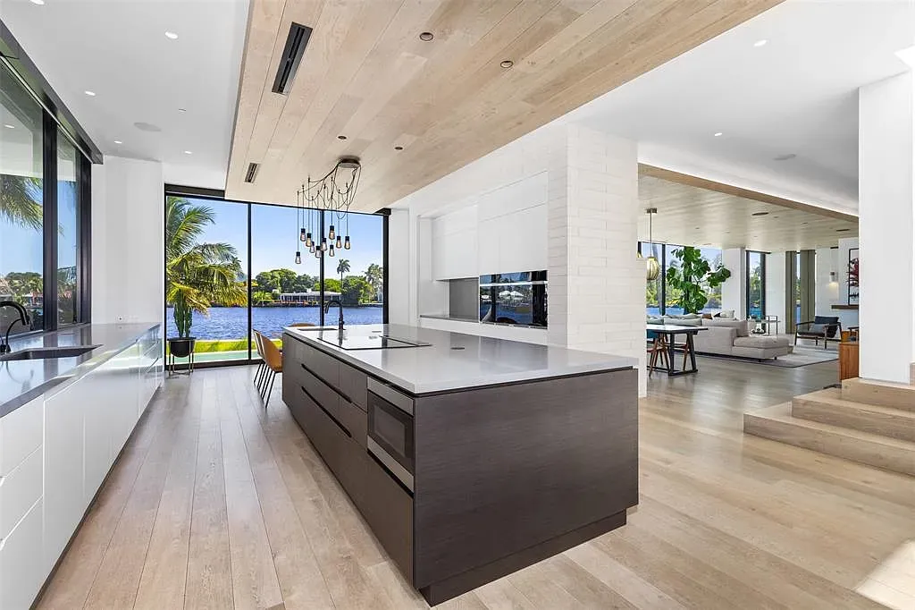 White cabinets with that chunky wood island—clean but not sterile. I’m into it.