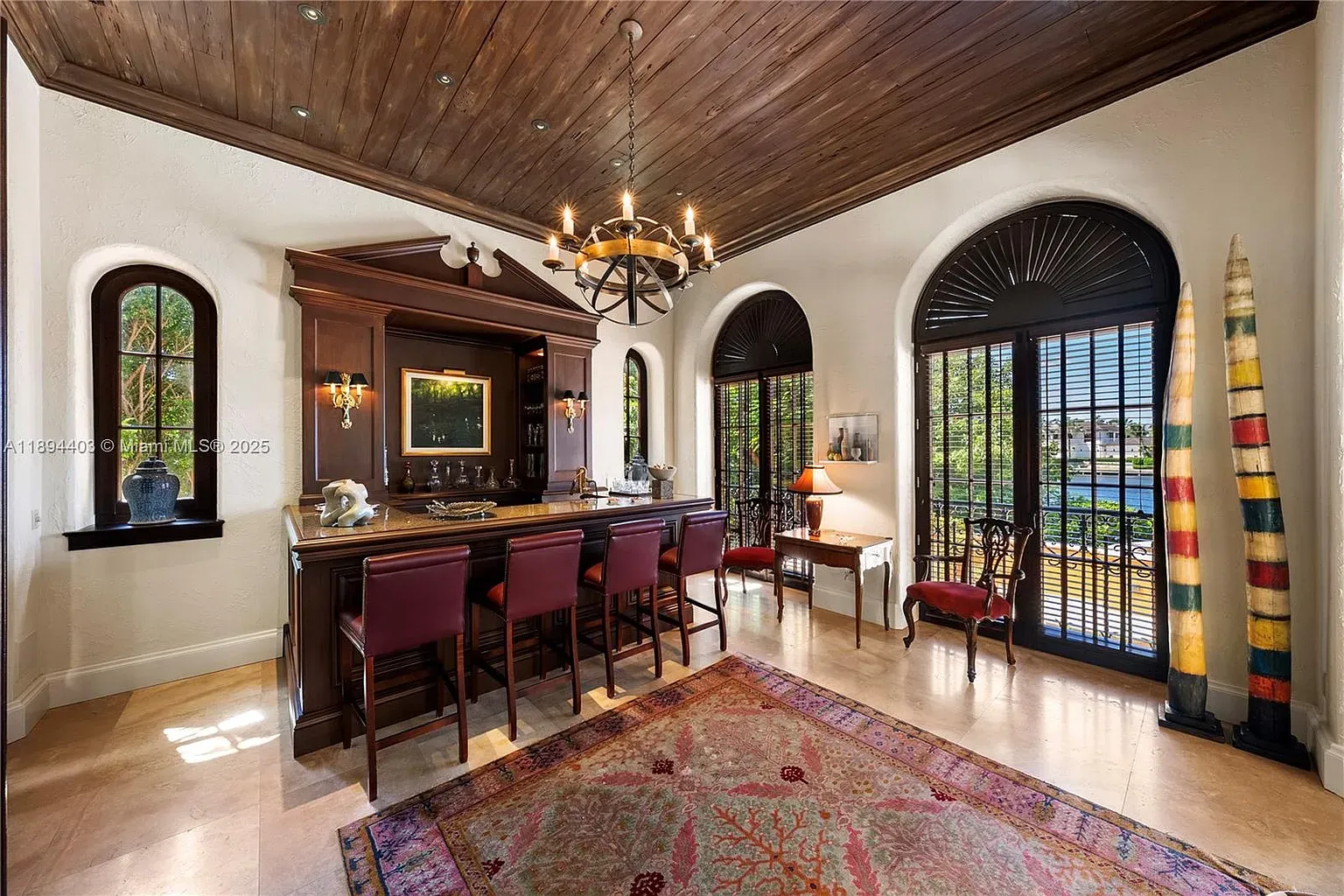 Inside, those dark beams against creamy walls. Cozy, a bit moody.