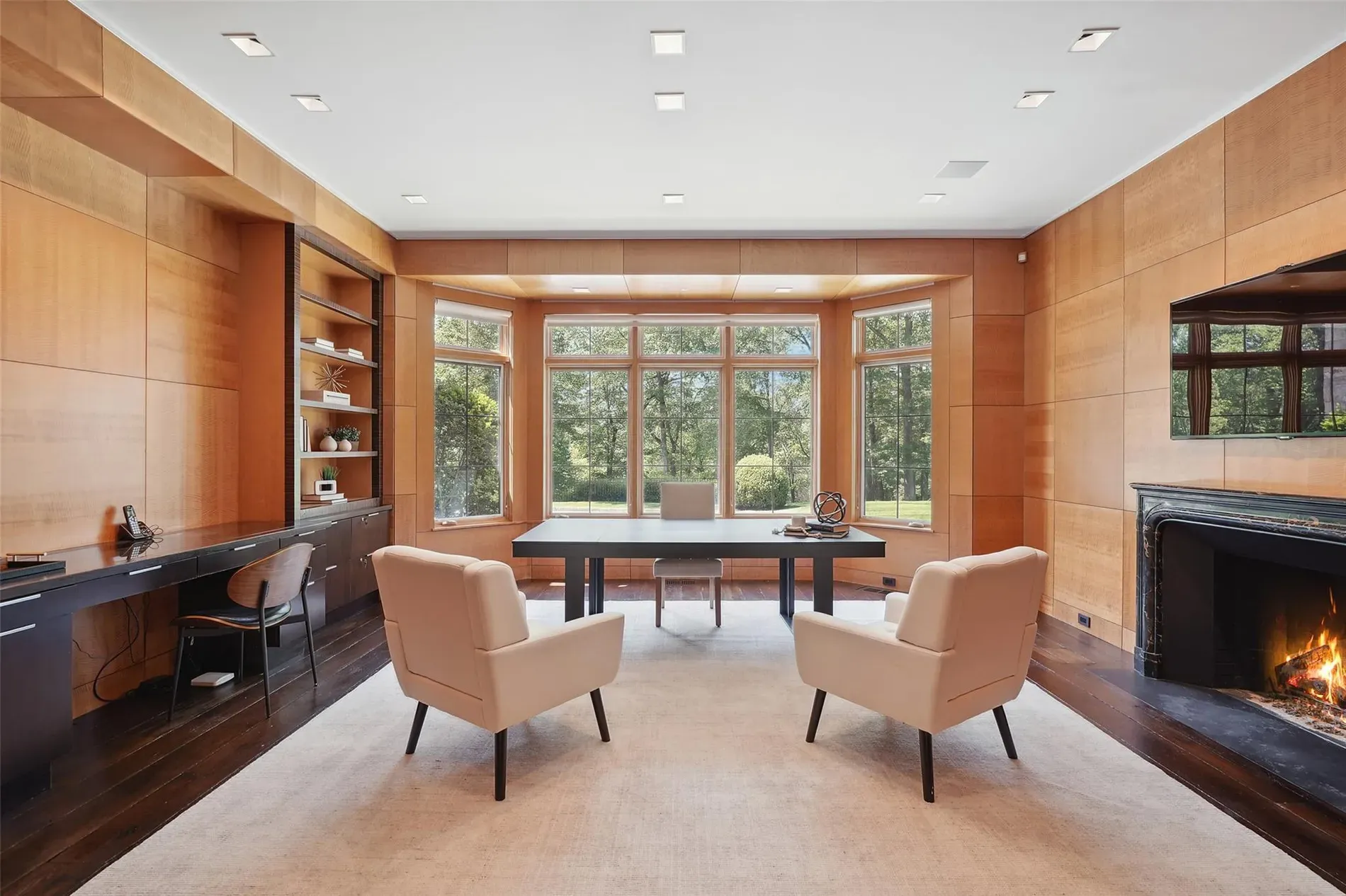 Office goals—honey wood everywhere, dark floor grounding it. Feels focused.