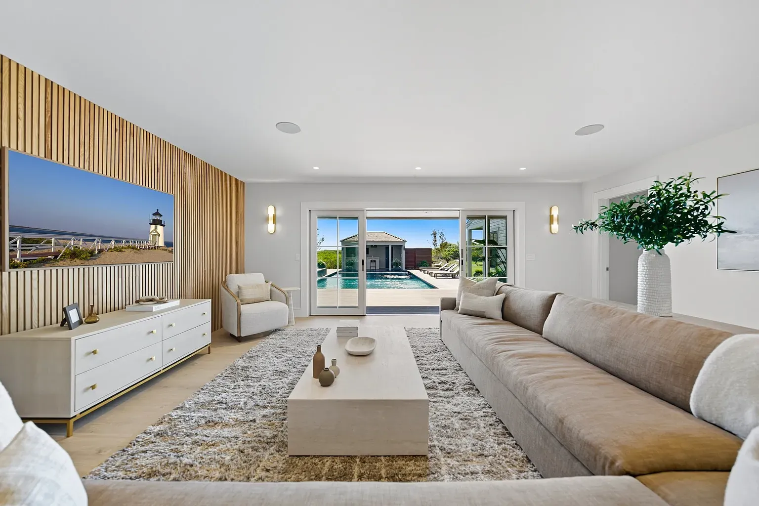 Minimalist living room—beige cloud couch, from this angle it actually works.