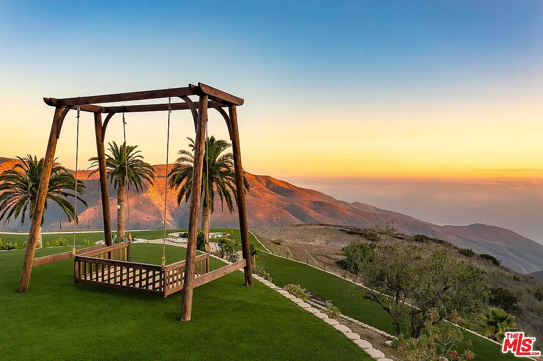 The swing! Rustic beams, simple lines. Cute spot for morning coffee.