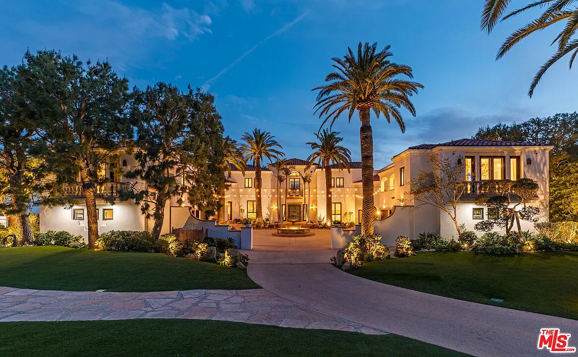 And then, big facade shot. cream stucco, terracotta, tall palms. Elegant, unfussy.