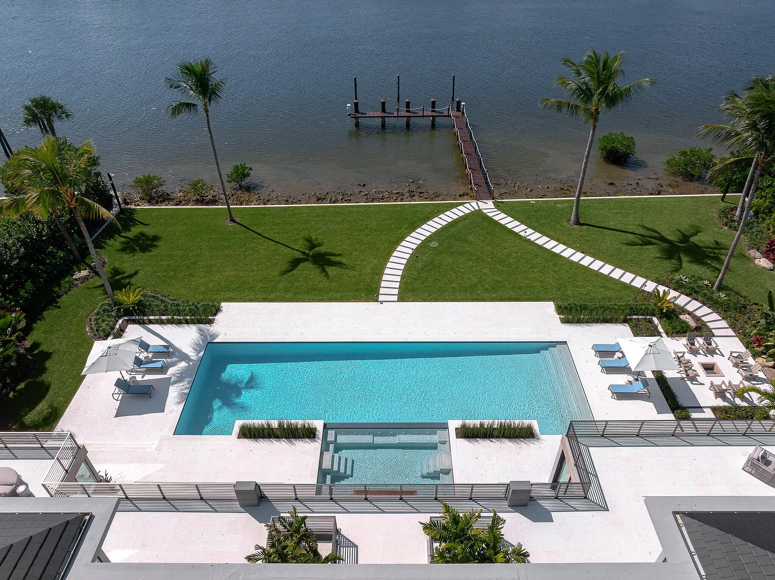 Pool is a perfect rectangle. turquoise looks unreal. Anyone else crave a swim?