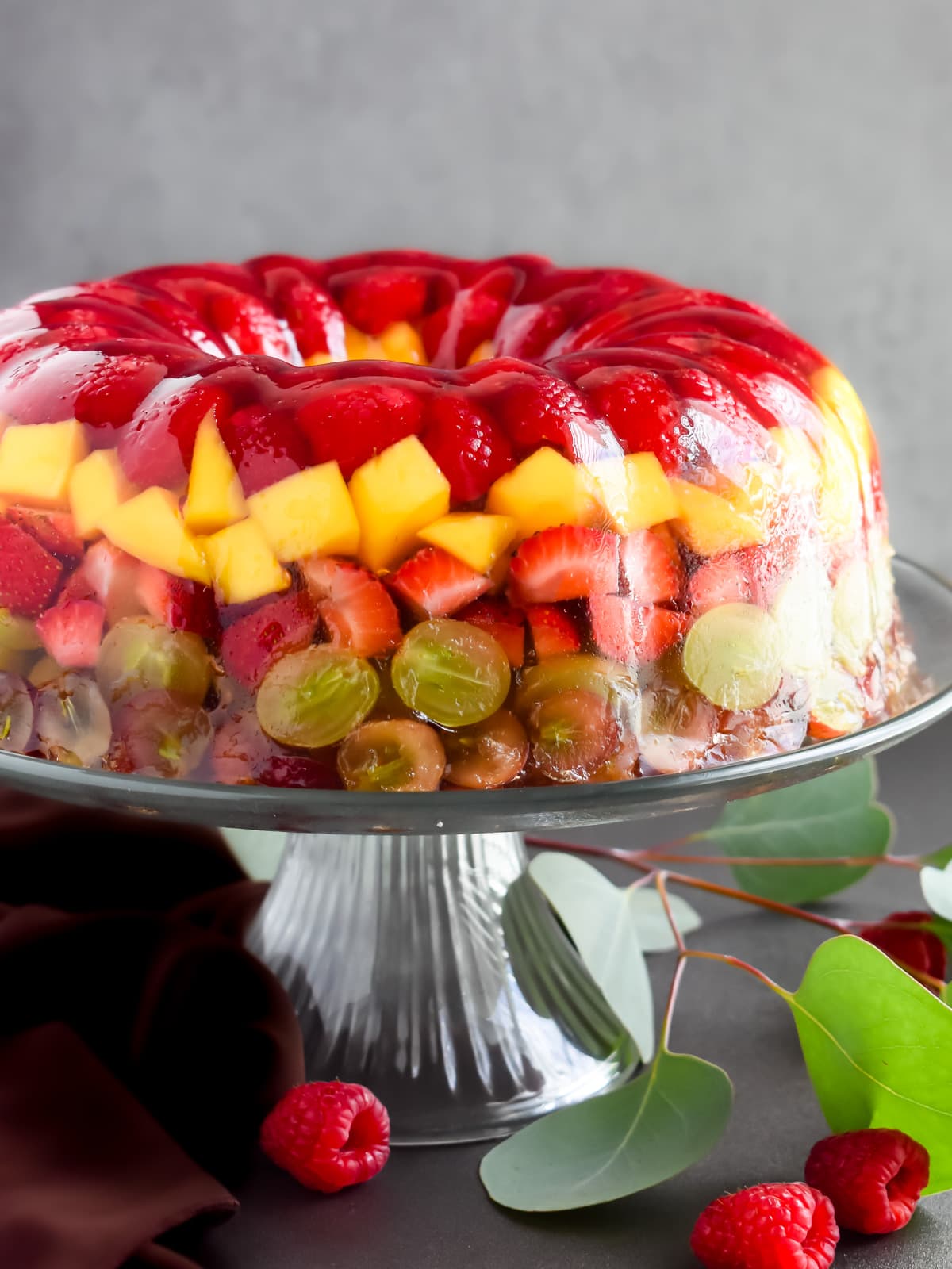 a vibrant gelatin fruit mold with colorful fruit