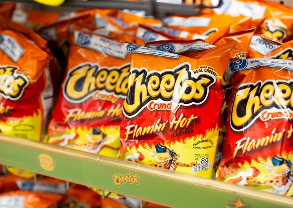 Flamin' Hot Cheetos Bags of Flamin' Hot Cheetos in a store display