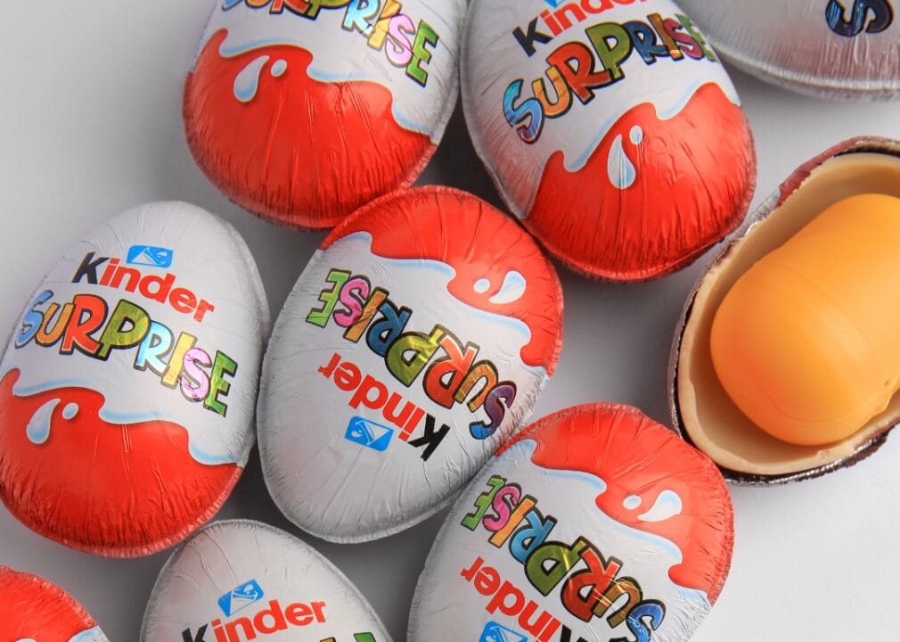 Kinder Surprise Eggs A collection of Kinder Eggs resting on a white surface.