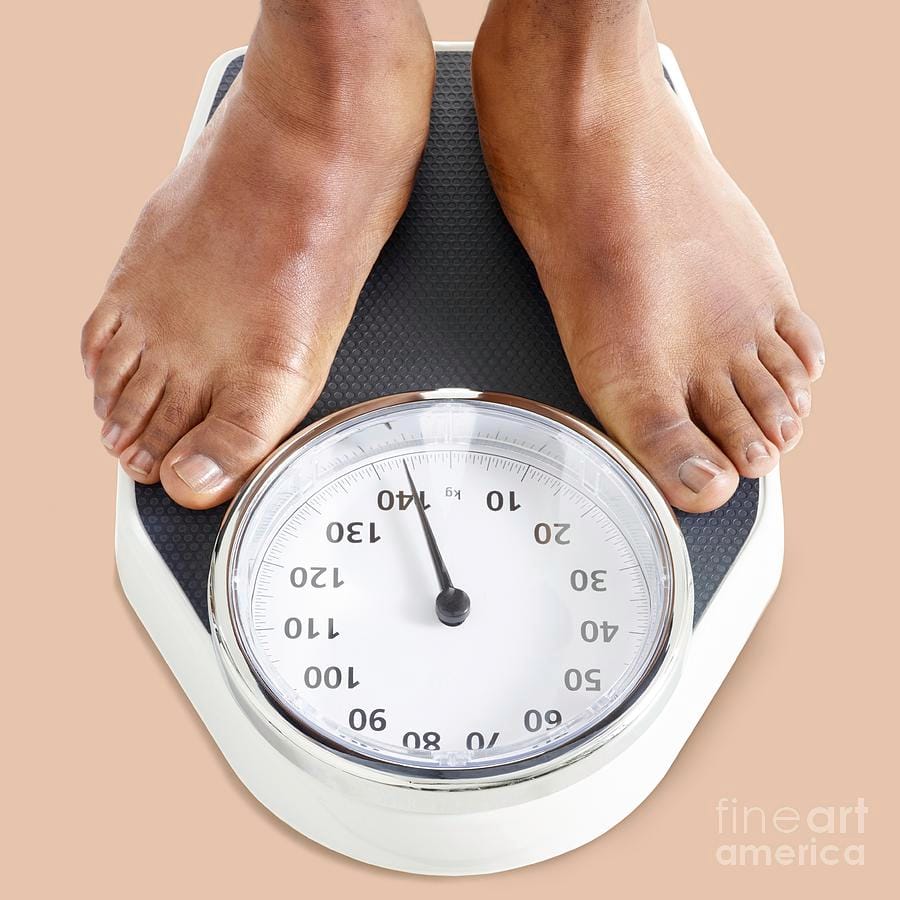 person standing on a scale