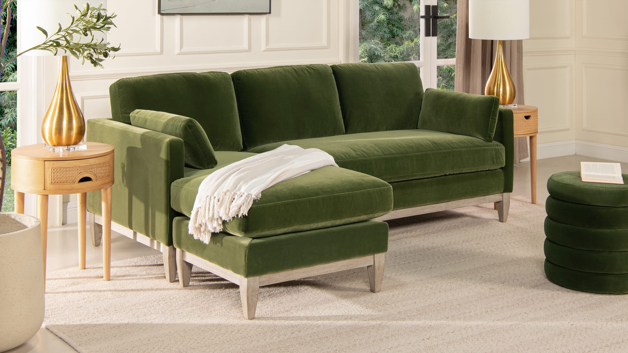 living room with olive green velvet sofa with reversible chaise and storage