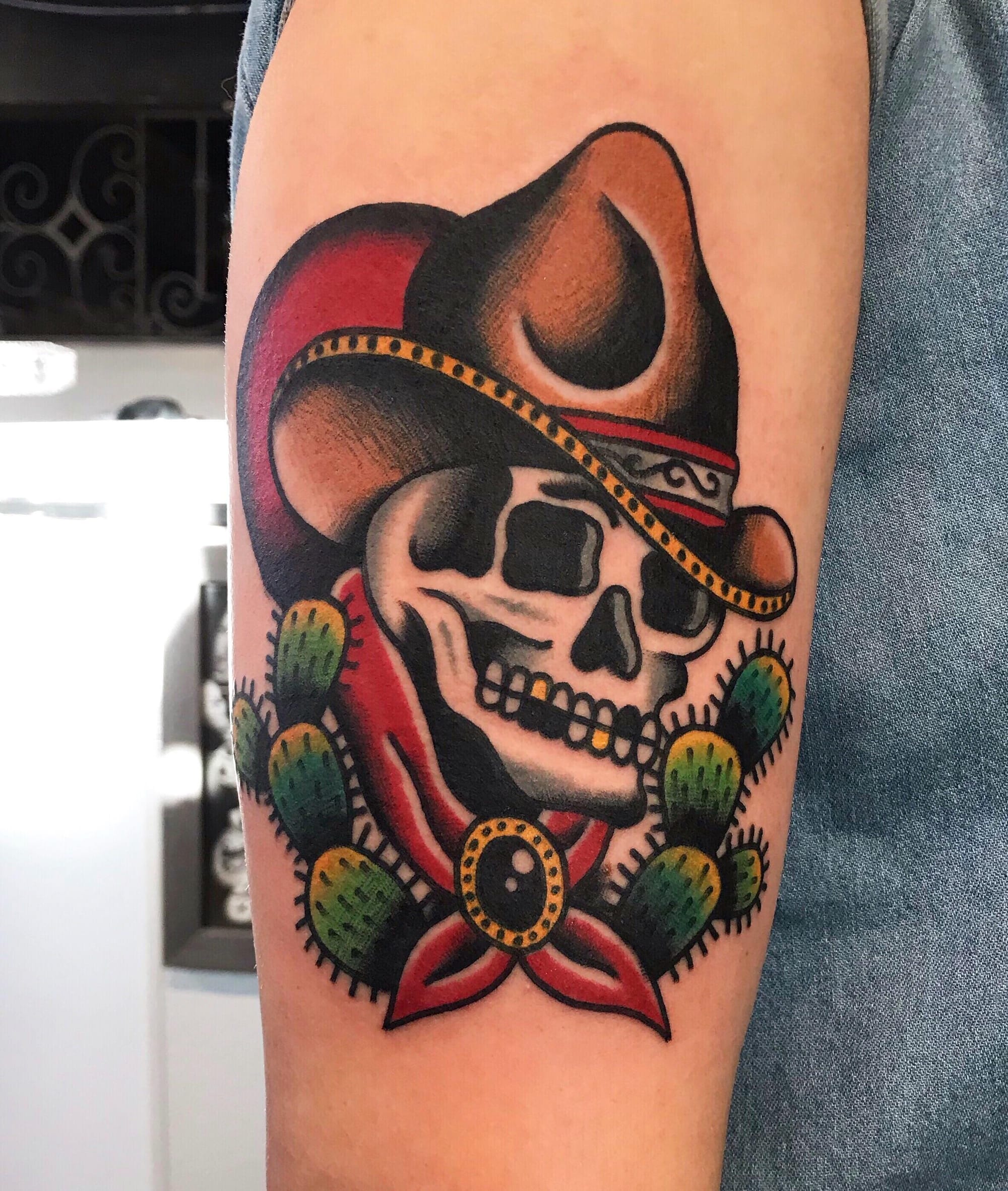 wild west with skull-topped cowboy hat tattoos in traditional style