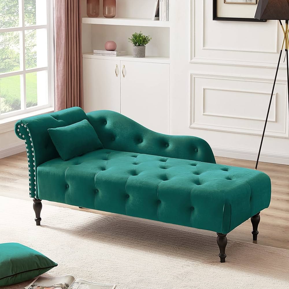 living room with teal green velvet chaise lounge with armrest and wooden base