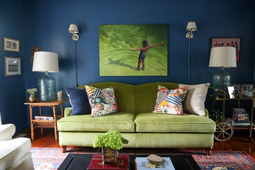 living room with chartreuse green velvet sofa with waterfall seat cushion and black legs