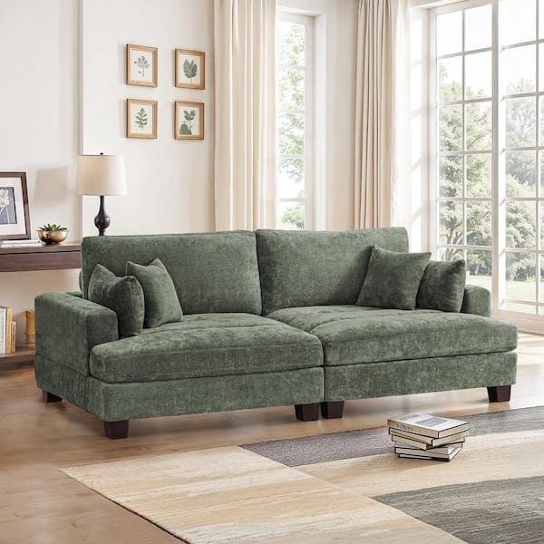 living room with moss green velvet loveseat with square arms and t-cushions